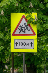 Road sign on city background