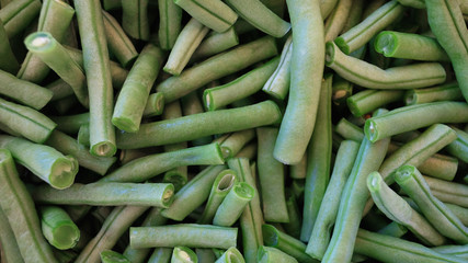 Raw french beans known also as haricot vert, cleaned and cut in short segments, ready to be used in a vegetarian or vegan dish or paired with other dishes, either blanched, fried, sauteed or steamed