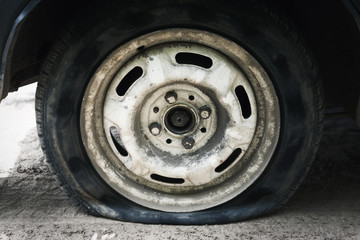 Flat tire. Punched wheel on a car. Close-up