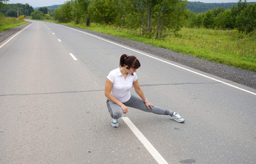 girl in a white t-shirt, gray pants goes in for sports