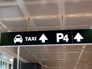 Taxi sign in airport close-up. Airport terminal Milan Malpensa 