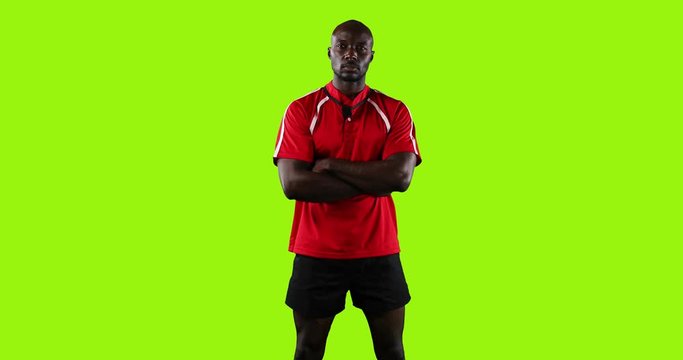 Professional rugby player standing with crossed arms 4k