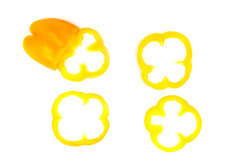 Yellow capsicum slices on white bavkground. Minimalism