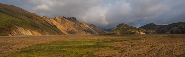 Beautiful scenic panorama of colorful volcanic mountains in Landmannalaugar camp site area of Fjallabak Nature Reserve in Highlands region of Iceland