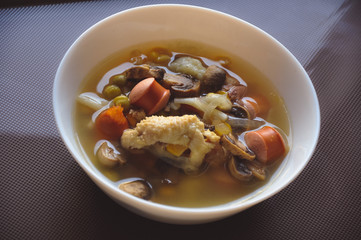 bowl of soup with meat and vegetables
