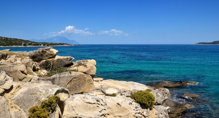 Fototapeta na wymiar Beautiful seascape with stones and translucent blue water