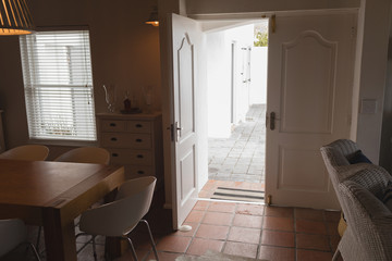 Entrance door opened in living room at home