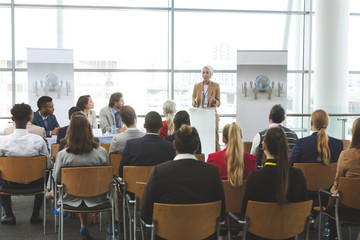 Female speaker speaks in a business seminar