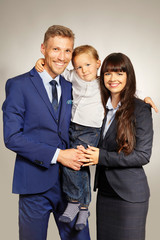 Young cute married couple with three years old son