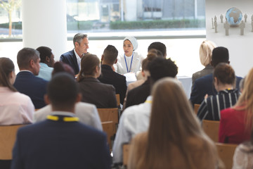 Group of business people attending a business seminar
