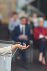 Female speaker speaks in a business seminar 