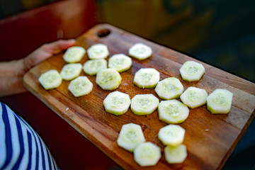 cucumber slices on a board