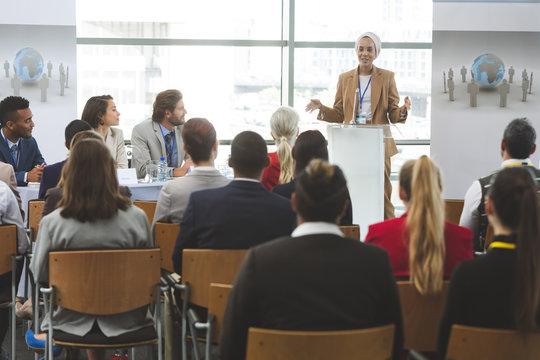 Female speaker speaks in a business seminar