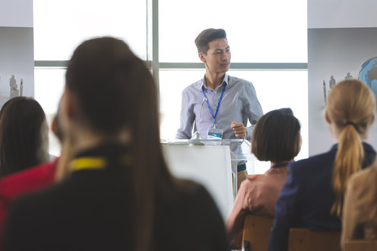 Asian businessman speaks at a business seminar