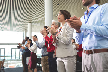 Business people applauding in a business seminar