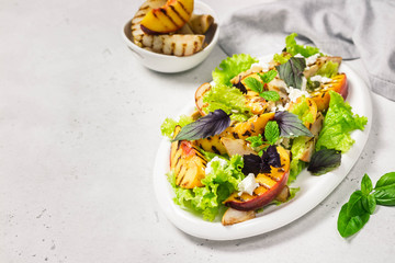Grilled peach feta summer salad. Selective focus, copy space.