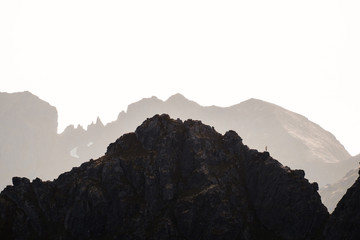 Person in the mountains. On the mountain summit. 