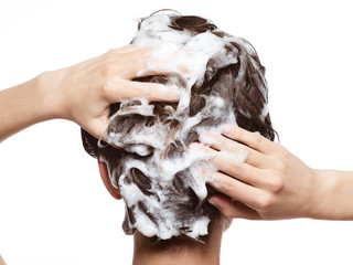 Woman soaping the hair. Beauty treatment - obrazy, fototapety, plakaty