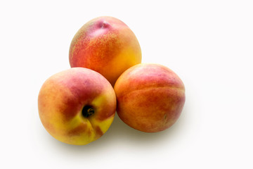 Ripe peaches isolated on white background.