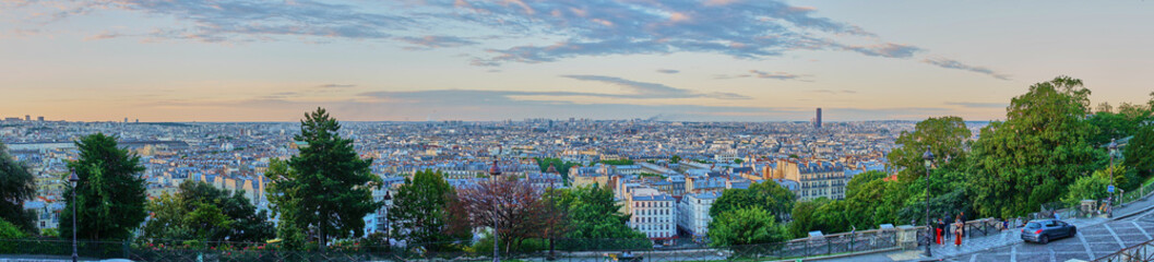 Fototapeta premium Panoramic view of Paris early in the morning at sunrise / Picture taken at Montmartre