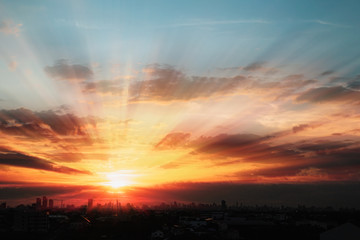 Sunset  with cityscape of building silhouette,At  twilight  in Bangkok ,Thailand