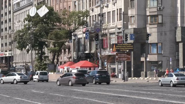 City video clip car traffic in Kiev, Ukraine 08/19/2019 in the area of European Square, a normal working sunny summer day
