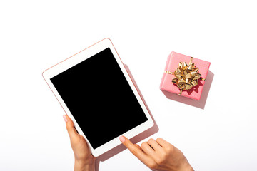 Woman's hands using tablet computer