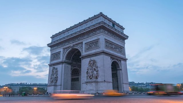 Paris France time lapse 4K, city skyline night to day timelapse at Arc de Triomphe and Champs Elysees