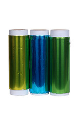 Photo of colored aluminum foil roll on white background