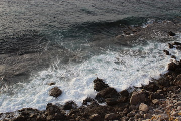 waves breaking on the rocks