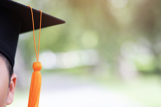graduation, close up student hat and tassel orange in during commencement success graduates of the university,Concept education congratulation. Graduate student University Degree.