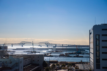 Tokyo, Japan - 13 DEC 2017: View of Tokyo Gate Bridge on the way to the capital in the break of dawn. The design fulfils the requirement to be high enough to allow large ships to pass underneath.