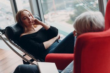 Consultation of young woman patient on reception for psychologist.