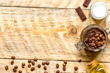 Body scrub of ground coffee top view on wooden table