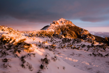 Fototapeta na wymiar Beautiful winter sunrise moment in the top of the mountain