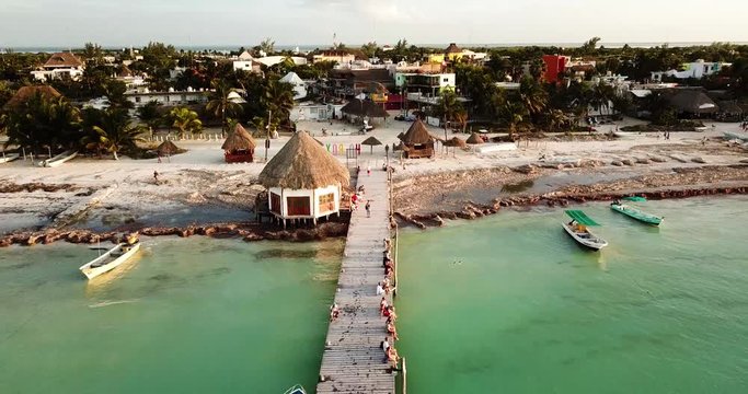 Scenic aerial zoom out shot of a beach of Isla Holbox on a clear sunny day in Mexico.