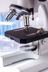 microscope in the laboratory with test tubes