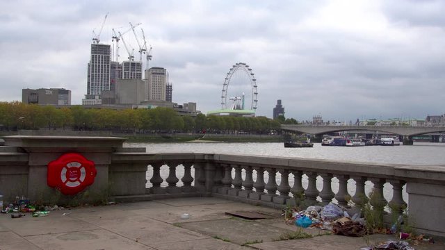 Day time London Victoria Embankment, urban cityscape, bunch of trash, social issue: waste management