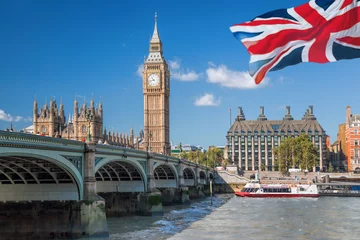 Fotobehang Big Ben and Houses of Parliament with boat in London, England, UK © Tomas Marek