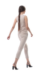 side view. confident young woman stepping forward