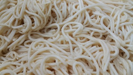 close up view of swirling noodles or spaghetti pasta