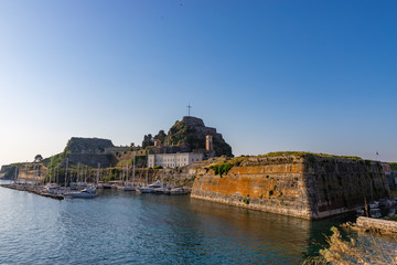 Naklejka premium Old fortress walls and clock tower Kerkyra city, Corfu, Greece