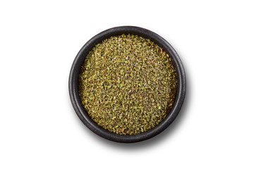 Oregano on dark bowl isolated on white background