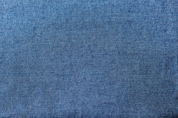 Fragment of the blue denim. Jeans background or texture.