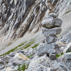 Fototapeta na wymiar signposts in the mountains, stacked of stones and rocks