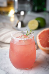 paloma cocktail with grapefruite on marble background