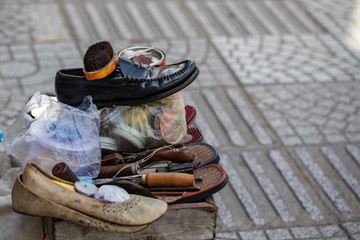 shoe shine on the streets of Asia, shoes for cleaning close-up, a place for printing