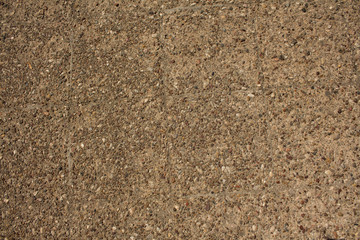 Rough beige concrete surface.