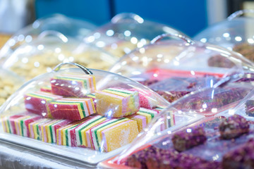 Traditional colorful sweet dessert close up at the famous market in Tel Aviv-Yafo, Israel. Traditional oriental sweets in shop.
