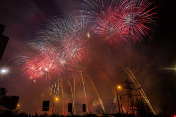 Red and yellow festive fireworks on a black background. Abstract holiday background. International Fireworks Festival ROSTEC